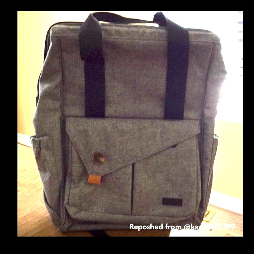 Diaper bag backpack with changing mat